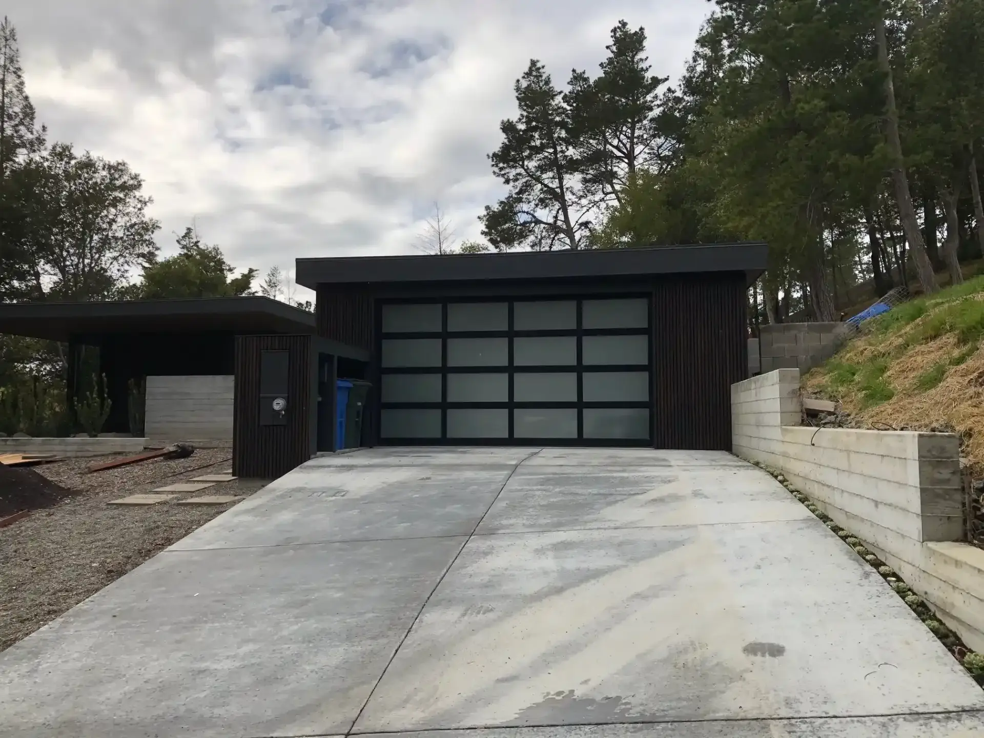 Technician professionally installing a garage door, highlighting the careful alignment and installation process