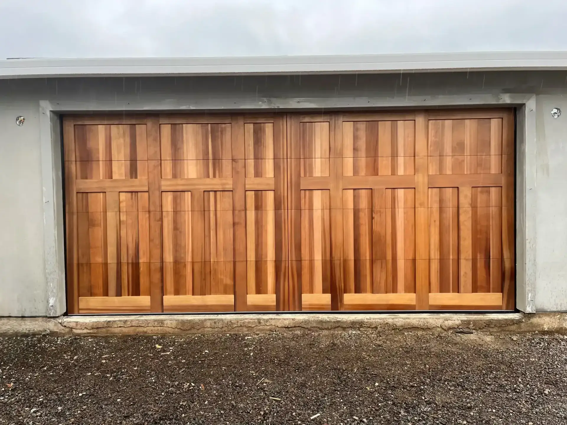 Comparison of wood, steel, aluminum, and fiberglass garage doors showcasing their unique features